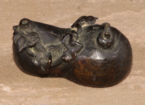 A Chinese bronze water dropper, cast as a gourd shaped fruit surmounted by a snail, 6cm long