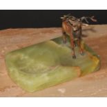 An Austrian cold painted bronze, of a stag, mounted on a green onyx dish, 14cm long, c.1930