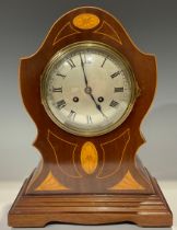 An Edwardian mahogany cartouche shaped mantel clock, silvered circular dial, Roman numerals, twin