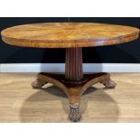 A William IV mahogany centre table, circular tilting top, fluted spreading cylindrical column,