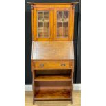 An Arts & Crafts oak bureau bookcase, 163cm high, 76cm wide, 35cm deep