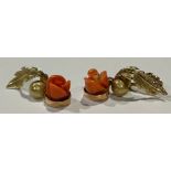 A pair of gold coloured metal and coral flowerhead earrings