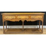 A George III style oak low potboard dresser, rectangular top above three frieze drawers, 78.5cm