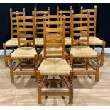 A set of eight oak ladderback dining chairs, probably Rupert/Nigel Griffiths Monastic Woodcraft,