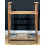 An Arts & Crafts oak walking stick or umbrella stand, the sides pierced with hearts, 88cm high, 68cm