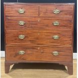 A Post-Regency mahogany chest, of two short and three long graduated drawers, 99.5cm high, 96.5cm