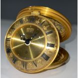 A Jaeger gilt brass circular folding eight day travel alarm clock, pierced foliate openwork case,