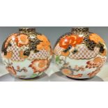 A pair of Derby Crown Porcelain Company globular vases, decorated in the Imari palette, pattern