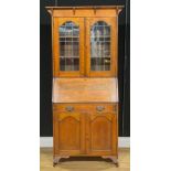 An Arts & Crafts oak bureau bookcase, 181cm high, 87cm wide, 32cm deep, c.1910