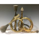 Automobilia - a coiled brass car horn, modelled as a snake; another coiled brass car horn; a Trico