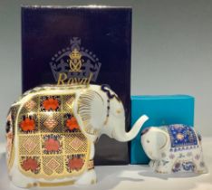 A Royal Crown Derby paperweight, Elephant, trunk raised, decorated in the 1128 Imari palette, gold