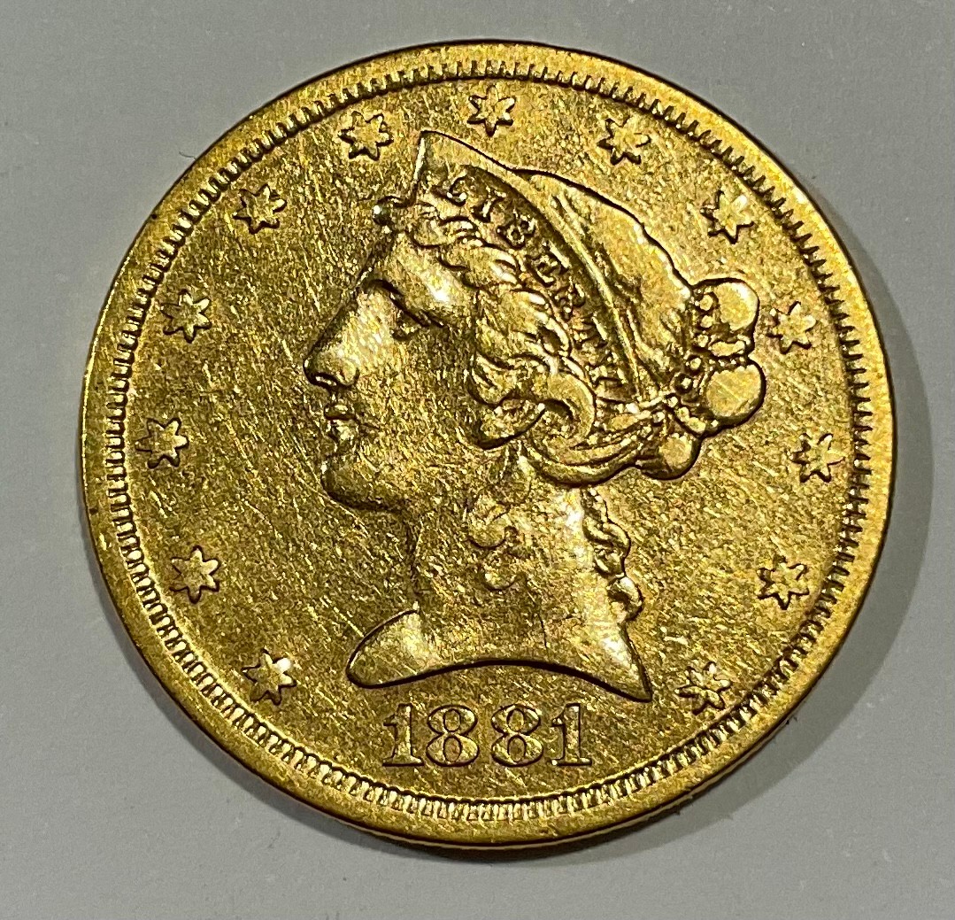 Coins - an American gold $5 coin, 1881