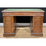 A George III Revival mahogany desk, discorectangular top with inset tooled and gilt writing