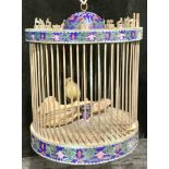 A Chinese cloisonne drum shaped bird cage, the cover mounted with animals of the Chinese zodiac,
