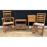 A Lancashire ash spindleback elbow chair, rush seat, 105cm high, 62.5cm wide, the seat 46cm wide and