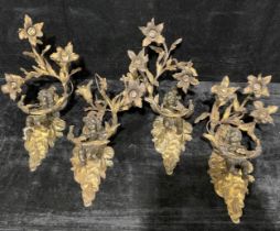 A suite of four Louis XV Revival dark patinated and parcel-gilt bronze three-light electrolier