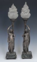 A pair of early 20th century silvered bronze figural table lamps, each as a Classical female figure,