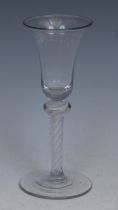 A George III opaque twist wine glass, trumpet shaped bowl, knopped stem with double-helix,