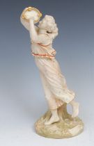 A Royal Worcester figure, after James Hadley, emblematic of music and joy, dancing holding a