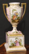 A Dresden porcelain mantel urn, the ovoid vase with angular scroll handles, painted with courting