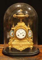 A late 19th century French gilt brass mantel clock, the white enamel dial with Roman numerals,