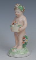 A Derby patch mark figure, Putto, garlanded with flowers, 10cm high, c.1780