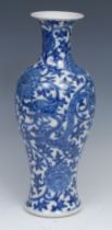A 19th century Chinese blauster blue and white vase, intricately decorated with Dragons amongst