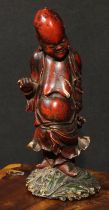 A Chinese cinnabar and polychrome lacquer figure, of Shoulao, holding a peach, 32cm high