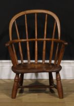 A 19th century elm and ash child’s Windsor elbow chair, low hoop back, saddle seat, turned legs, H-