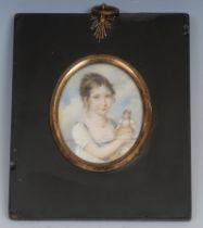 English School, 19th century, a portrait miniature, of a young girl with a doll, watercolour on