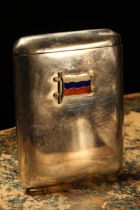 A George V silver and enamel rounded rectangular cigarette case, of Russian interest, sprung