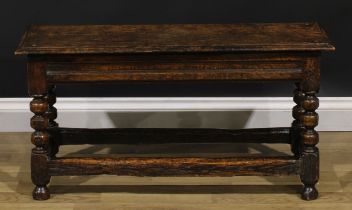 A 17th century style oak double-width joint stool, rectangular seat with moulded edge, turned and