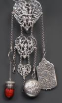 A 19th century silver coloured metal chatelaine, the heart shaped clip pierced and cast with