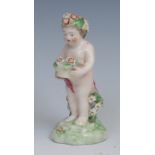 A Derby patch mark figure, Putto, garlanded with flowers, 10cm high, c.1780