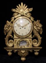 A Gustavian style Swedish giltwood and gesso wall clock, 20cm circular dial inscribed Fritz Gelhaar,