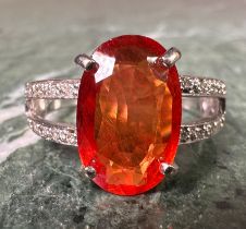 A certified orange fancy sapphire and diamond ring, central oval orange sapphire, 3.88ct, open