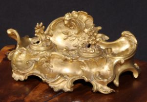 A 19th century Rococo Revival gilt bronze inkstand, the two wells with hinged covers, cast