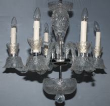 A pair of Royal Brierley clear glass chandeliers, each with six lights on scroll arms, prismatic cut