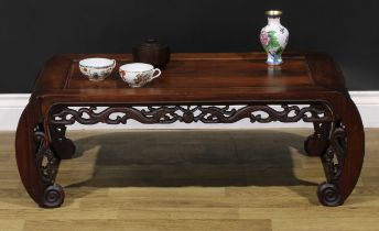 A Chinese hardwood low tea or kang table, panelled top above a deep frieze pierced and carved with