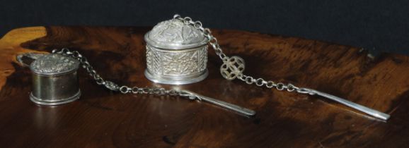 A Middle Eastern silver makhalah kohl pot, chased with blossom, the mirwad applicator attached