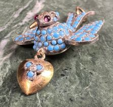 A Belle Époque unmarked dove pendant, set with an arrangement of graduated polished turquoise beads,