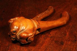 Nutcrackers - a Black Forest lever-action nut cracker, boldly carved as the head of a bulldog, glass