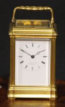 A late 19th century gilt brass repeating carriage clock, 6cm rectangular enamel dial inscribed