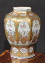 A 19th century Chinese famille rose octagonal baluster vase, painted with baskets of flowers, gilt