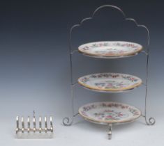 A George V silver three tier cake stand, shaped handle, 39.5cm high, Travis, Wilson & Co Ltd,