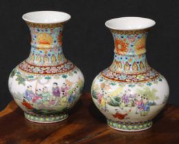 A pair of Chinese ovoid vases, painted in polychrome with Hundred Boys, bats and auspicious symbols,