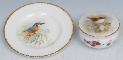 A Royal Worcester plate, painted by W. Powell, signed, with a kingfisher perched on a leafy