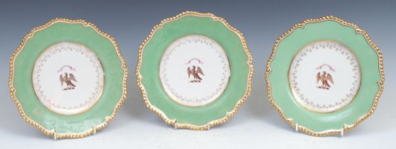 A set of three Flight Barr & Barr shaped circular Armorial plates, centred with eagle crest below