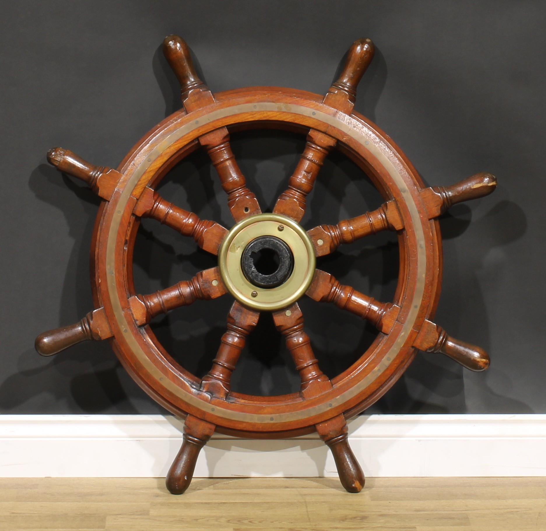An early 20th century brass bound oak ship’s wheel, iron hub, turned spokes, 93cm diameter - Image 2 of 2