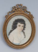 English School, 19th century, a portrait miniature, of a lady, head and shoulders, long black